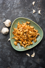 Garlic Fry or Tala Hua Lahsun in hindi, is a popular side dish or snacks from maharashtra, India