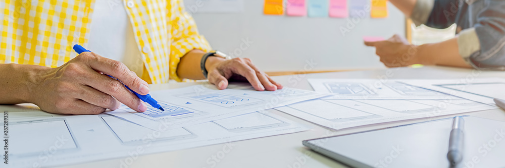 Wall mural creative web designer planning application and developing template layout, framework for mobile phon