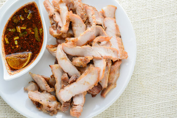 Grilled Pork with Thai Spicy Sauce, it can be served as an appetizer; it can also be served as an entrée with hot-off-the-splatter-guard sticky rice or plain steamed jasmine rice.