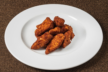 chicken nuggets on the white plate