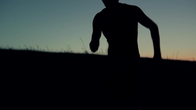Running Runner Triathlon Silhouette Jogging At Dusk On Trail In Nature.Triathlete Runner On Sunset .Running In Trail At Sunset Dusk.Runner Silhouette Training  Before Marathon Or Triathlon At Sunrise