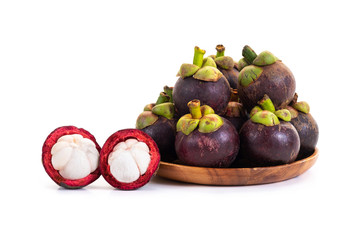 Mangosteen and cross section showing the thick purple skin and white on white background. Queen of friuts.