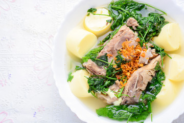 Ivy gourd soup with Soft white bean curd and pork bone