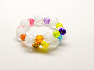 Multi-colored bracelets with beads. Colourful child's bead bracelet.