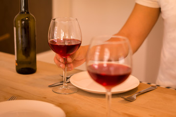 Two people dining and drinking wine together.