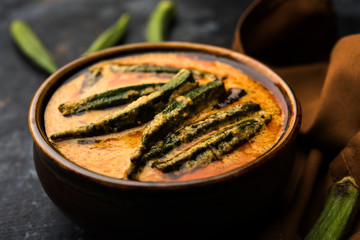 Hyderabadi Bhindi ka Salan or Okra salan made using ladies' fingers or ochro. Main course recipe from India. served in a bowl. selective focus