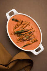 Hyderabadi Bhindi ka Salan or Okra salan made using ladies' fingers or ochro. Main course recipe from India. served in a bowl. selective focus