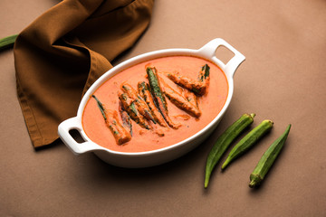 Hyderabadi Bhindi ka Salan or Okra salan made using ladies' fingers or ochro. Main course recipe from India. served in a bowl. selective focus