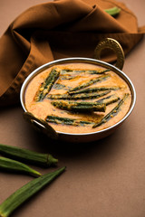 Hyderabadi Bhindi ka Salan or Okra salan made using ladies' fingers or ochro. Main course recipe from India. served in a bowl. selective focus