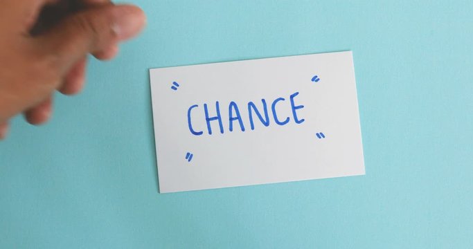 hand flip the paper card of  change  to chance word ,motivation for changing mindset from negative to positive concept