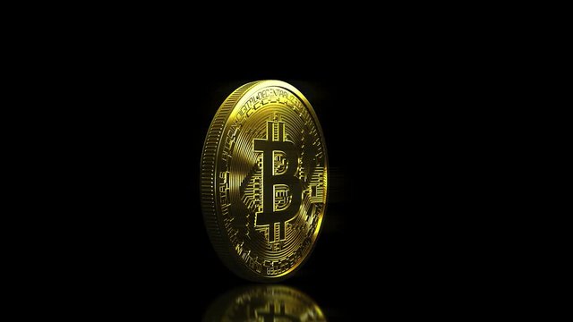 Video animation of a golden rotating bitcoin over dark reflecting background - Digital currency - Cryptocurrency
