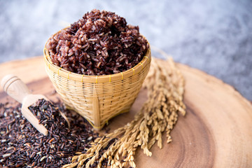 Jasmine rice, Brown rice in wicker basket with wooden spoon, yellow paddy rice, Coarse grain and coarse grain farmer organic black rice, Selective focus.