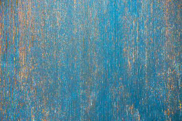 Dark stained blue teal reclaimed wood surface with aged boards lined up. Wooden planks on a wall or floor with grain and texture. Stained vintage wood background.
