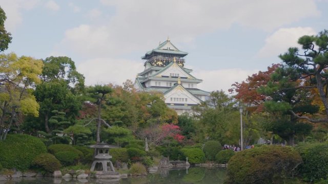 Osaka Castle Japan, Historic Landmark From 16th Century.Autumn Garden View Over Pond