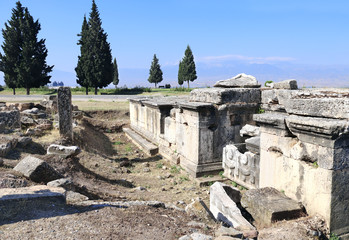 Fototapeta na wymiar Ruins of tombs in necropolis, Hierapolis, Pamukkale, Turkey
