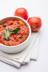 Tomato/tamatar chutney or sauce, served in a bowl. selective focus