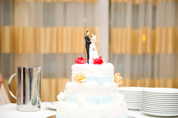 wedding cake with bride and groom figurines