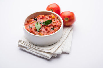 Tomato/tamatar chutney or sauce, served in a bowl. selective focus