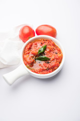 Tomato/tamatar chutney or sauce, served in a bowl. selective focus