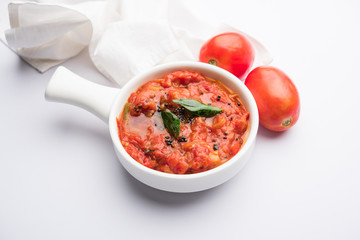 Tomato/tamatar chutney or sauce, served in a bowl. selective focus