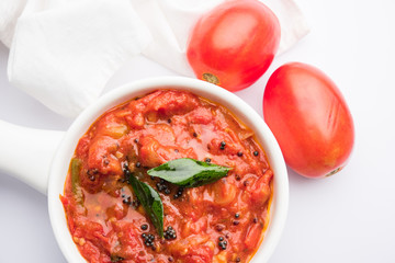 Tomato/tamatar chutney or sauce, served in a bowl. selective focus