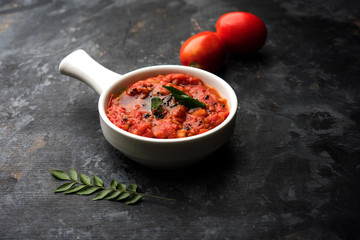 Tomato/tamatar chutney or sauce, served in a bowl. selective focus
