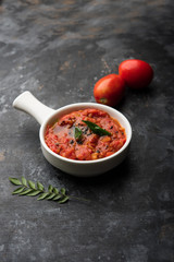 Tomato/tamatar chutney or sauce, served in a bowl. selective focus
