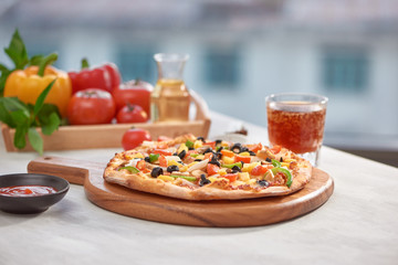 Appetizing homemade pizza on a white background