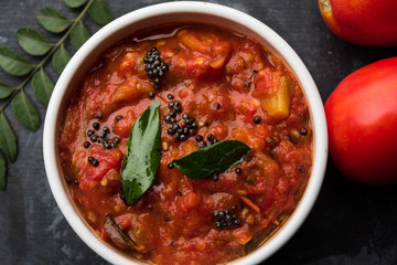 Tomato/tamatar chutney or sauce, served in a bowl. selective focus