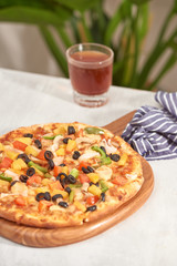 Appetizing homemade pizza on a white background
