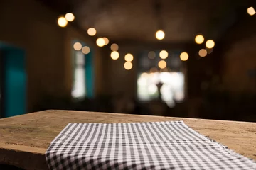 Foto op Canvas red tablecloth on wooden background empty deck © kishivan