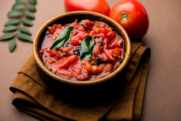 Tomato/tamatar chutney or sauce, served in a bowl. selective focus