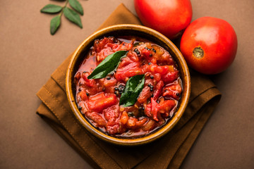 Tomato/tamatar chutney or sauce, served in a bowl. selective focus