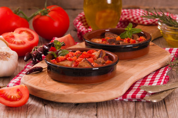 Marinated pork loin in tomato sauce. 