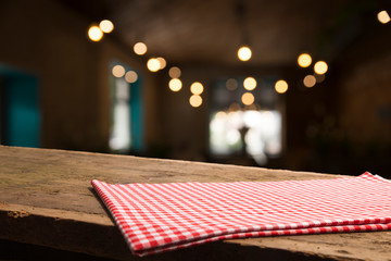 red tablecloth on wooden background empty deck