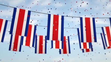 Costa Ricans flags in the sky with confetti. - Powered by Adobe