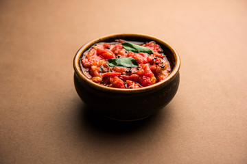 Tomato/tamatar chutney or sauce, served in a bowl. selective focus