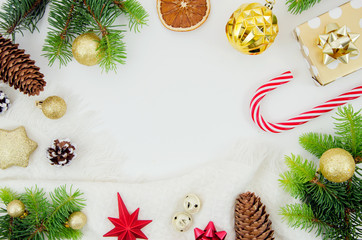 Christmas flat lay frame mockup. Pine cones, fir branches and Christmas balls on white background. Top view with copy space for greeting card