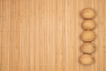 Strip of walnuts on a warm background