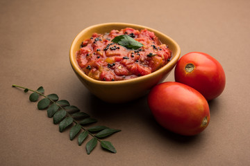 Tomato/tamatar chutney or sauce, served in a bowl. selective focus