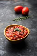Tomato/tamatar chutney or sauce, served in a bowl. selective focus