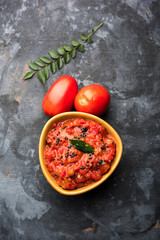 Tomato/tamatar chutney or sauce, served in a bowl. selective focus