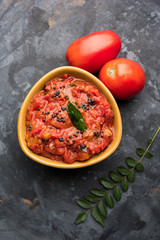 Tomato/tamatar chutney or sauce, served in a bowl. selective focus