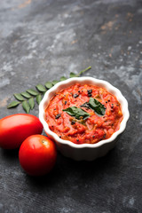 Tomato/tamatar chutney or sauce, served in a bowl. selective focus