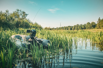 Fishing in an inflatable boat with a motor.