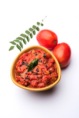 Tomato/tamatar chutney or sauce, served in a bowl. selective focus