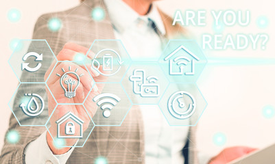 Writing note showing Are You Ready Question. Business concept for used telling someone start something when feel prepared Female human wear formal work suit presenting smart device