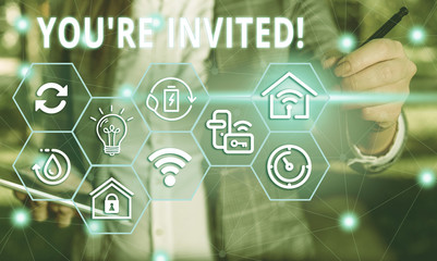 Word writing text You Re Invited. Business photo showcasing make a polite friendly request to someone go somewhere Female human wear formal work suit presenting presentation use smart device