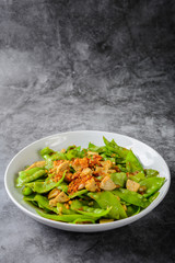 Stir Fry Snow Peas with Vietnamese Grilled Pork Sausage, topping with crispy fried shallots and garlics
