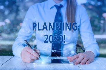 Conceptual hand writing showing Planning 2020. Concept meaning process of making plans for...